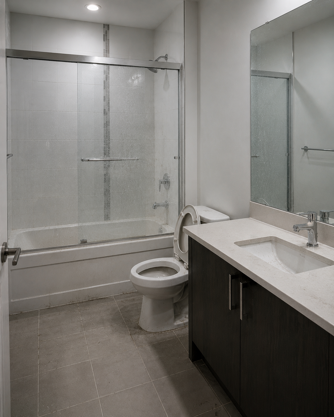 Calgary bathroom before move-out cleaning — grimy shower and surfaces
